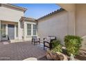 Serene courtyard featuring a cozy seating area with modern chairs and desert plants at 5142 N 205Th Gln, Buckeye, AZ 85396