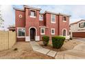 Beautiful terracotta two-story home with a tiled roof and manicured gravel landscaping at 924 E Redondo Dr, Gilbert, AZ 85296