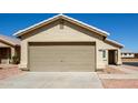 Charming single-story home featuring a two-car garage and low maintenance desert landscaping at 12240 W Scotts Dr, El Mirage, AZ 85335