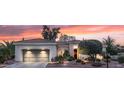 Beautiful single-story home with a landscaped front yard and a gray two-car garage at 12839 W Rincon Ct, Sun City West, AZ 85375