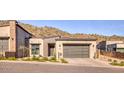 Attractive modern home with desert landscaping and a three car garage at 14455 N Adero Canyon Dr, Fountain Hills, AZ 85268