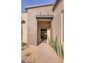 Inviting front entrance with a desert landscape and a modern architectural design at 14455 N Adero Canyon Dr, Fountain Hills, AZ 85268
