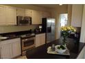 Well-equipped kitchen featuring stainless steel appliances and dark countertops at 14462 N Sherwood Dr # B, Fountain Hills, AZ 85268