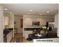 Bright kitchen with stainless appliances, ample cabinets, and a center island at 14462 N Sherwood Dr # B, Fountain Hills, AZ 85268
