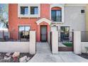 Inviting townhome entrance with covered porch and gate access to a cozy front patio at 1950 N Center St # 101, Mesa, AZ 85201