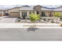 Attractive one-story house with desert landscaping, showcasing a well-maintained lawn and inviting curb appeal at 20961 E Stacey Rd, Queen Creek, AZ 85142