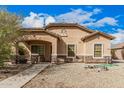 Charming single-story home with a well-maintained landscape, stone accents, and covered porch at 21752 E Domingo Rd, Queen Creek, AZ 85142