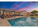 Backyard pool and patio area with outdoor seating, ideal for relaxing and entertaining in the Arizona heat at 3690 E Blue Spruce Ln, Gilbert, AZ 85298