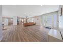 Spacious living room with wood floors, modern furnishings, and ample natural light at 6320 N 4Th Pl, Phoenix, AZ 85012