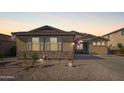 Charming single-story home featuring a well-maintained front yard and neutral-toned exterior at 6822 W Alta Vista Rd, Laveen, AZ 85339