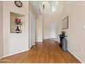 Bright foyer with vaulted ceilings, wood flooring, and decorative niches at 705 W Queen Creek Rd # 1201, Chandler, AZ 85248