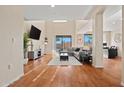 Spacious living room featuring wood floors, lots of light, and a comfortable sectional sofa at 705 W Queen Creek Rd # 1201, Chandler, AZ 85248
