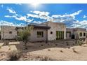 Beautiful exterior featuring stone accents, desert landscaping, and a modern architectural design at 7498 E Whisper Rock Trl, Scottsdale, AZ 85266