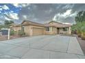 Inviting exterior with a two-car garage, well-maintained landscaping, and concrete driveway at 7822 S 15Th Way, Phoenix, AZ 85042