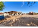 Spacious home with a covered patio, perfect for enjoying the outdoors and views of the property at 836 W Lenora Way, San Tan Valley, AZ 85140