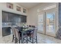 Eat-in kitchen area with a built-in desk, a view of the back, and modern finishes at 8504 S 30Th St, Phoenix, AZ 85042