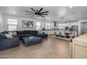 Open-concept living room featuring tile floors, large windows, and modern decor at 9718 E Radioactive Dr, Mesa, AZ 85212