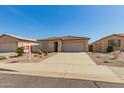 Charming single-story home with a two-car garage, desert landscaping, and a welcoming facade at 11023 W Utopia Rd, Peoria, AZ 85373