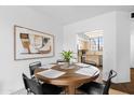 Dining area near the kitchen, featuring round table and modern art at 11515 N 91St St # 142, Scottsdale, AZ 85260