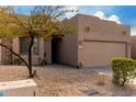 Charming single-story home featuring desert landscaping, and a two-car garage at 11779 E Becker Ln, Scottsdale, AZ 85259