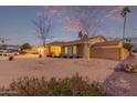 Beautiful shot of a home with desert landscaping, a brick facade, and a two-car garage at 2248 W Mandalay Ln, Phoenix, AZ 85023