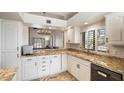 Well-lit kitchen showcasing granite countertops, white cabinetry, and modern appliances at 25515 N Forest N Rd # 2, Rio Verde, AZ 85263