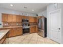 Well-appointed kitchen with stainless steel appliances and spacious countertops at 366 E Mule Train Trl, San Tan Valley, AZ 85143