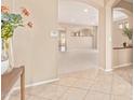 Inviting home entryway featuring decorative tile flooring, neutral paint, arches and an open layout at 44 W Teakwood Pl, Chandler, AZ 85248