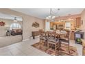 Inviting dining room with adjacent living room and kitchen, great for entertaining guests at 4720 E Flossmoor Cir, Mesa, AZ 85206