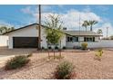 Charming single-story home featuring a well-maintained desert landscape and attached garage at 501 E Hermosa Dr, Tempe, AZ 85282