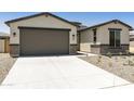 Lovely home featuring a convenient two-car garage and low-maintenance landscaping at 5508 N 192Nd Ave, Litchfield Park, AZ 85340