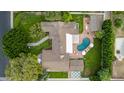 Aerial shot of a property showcasing a pool, lush landscaping, and architectural details of the home at 5801 E Exeter Blvd, Phoenix, AZ 85018