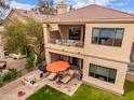 A lovely backyard featuring a patio, balcony, and well-manicured lawn at 7525 E Gainey Ranch Rd # 110, Scottsdale, AZ 85258