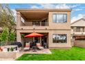 Exterior of home featuring a patio, balcony, lush lawn and desert landscaping at 7525 E Gainey Ranch Rd # 110, Scottsdale, AZ 85258