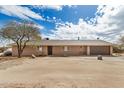 Ranch-style home with neutral paint, a two-car garage, and a desert landscape at 8431 W Planada Ln, Peoria, AZ 85383