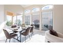 Dining room with a large window and access to outdoor spaces at 9113 N 116Th Way, Scottsdale, AZ 85259