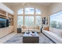 Open-concept living area boasting high ceilings and walls of windows with natural light at 9113 N 116Th Way, Scottsdale, AZ 85259