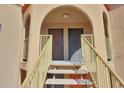 Arched entryway with painted staircase leading to the front doors, offering a secure entrance at 13035 N 34Th St # 7, Phoenix, AZ 85032