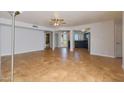 Spacious living room featuring tile floors, a ceiling fan, and a view of the kitchen at 13035 N 34Th St # 7, Phoenix, AZ 85032