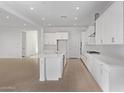 Spacious open-concept kitchen with a large island and seamless flow to the living area at 15846 W Bronco Trl, Surprise, AZ 85387