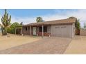 Charming single-story home with desert landscaping, brick accents, and brick driveway at 16833 N 17Th Pl, Phoenix, AZ 85022