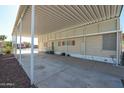 Spacious covered parking area with ample space for vehicles and storage at 17244 N 66Th Ln, Glendale, AZ 85308
