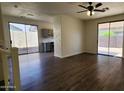 Living room with sliding glass doors leading to the back yard and an open floorplan at 2143 N 30Th St, Mesa, AZ 85213