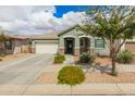 Lovely single-story home with a well-manicured lawn and inviting curb appeal, perfect for a cozy living environment at 22552 E Via Estancia --, Queen Creek, AZ 85142