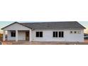 New construction home featuring bright white stucco exterior and dark framed windows at 231Xx W Gloria Ln, Wittmann, AZ 85361