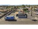 The aerial view shows a fenced in backyard and a large moving truck outside the property at 2921 W Luke Ave, Phoenix, AZ 85017