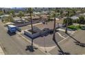 A corner lot featuring a well-maintained home with gravel landscaping and palm trees at 2921 W Luke Ave, Phoenix, AZ 85017