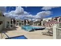 Inviting community pool area with lounge chairs and a serene atmosphere at 5518 E Lindstrom Ln # 1034, Mesa, AZ 85215