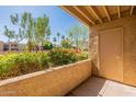 Balcony view with desert landscaping and flowering shrubs creating a private outdoor space at 5877 N Granite Reef Rd # 1145, Scottsdale, AZ 85250