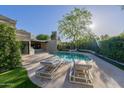 A stunning pool with lounge chairs and a spacious patio, perfect for relaxing at 7278 E Echo Ln, Scottsdale, AZ 85258